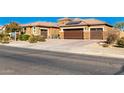 House exterior with a large driveway and two-car garage at 18904 W Mercer Ln, Surprise, AZ 85388