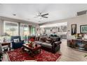 Spacious living room featuring comfortable seating and a view of the kitchen at 18904 W Mercer Ln, Surprise, AZ 85388