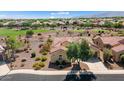 Single-story home with a tile roof and a large backyard, located near a golf course at 20515 N 264Th Ave, Buckeye, AZ 85396