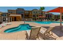 Community pool and spa area with comfortable lounge chairs at 2150 W Alameda Rd # 1112, Phoenix, AZ 85085