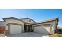 Charming single-story home featuring a two-car garage and inviting entryway with a colorful accent chair at 2441 W Beverly Rd, Phoenix, AZ 85041