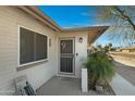 Front door entrance with security door and sidelights, welcoming guests into the home at 2543 E Manhatton Dr, Tempe, AZ 85282