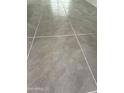 Close up of neutral tone large tile flooring at 25519 W Brookhart Way, Wittmann, AZ 85361