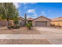 One-story home with a two-car garage and drought-tolerant landscaping at 2629 E Santa Maria Dr, Casa Grande, AZ 85194