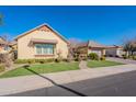 Beautiful single-story home with a landscaped yard and two-car garage at 2952 E Warbler Rd, Gilbert, AZ 85297