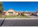 Beautiful single-story home with a landscaped yard and two-car garage at 2952 E Warbler Rd, Gilbert, AZ 85297