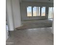 View of light and airy living room with recessed lighting and tile flooring at 29577 N 220Th Ave, Wittmann, AZ 85361