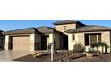 Single-story home with stone accents and desert landscaping at 3020 N 165Th Ave, Goodyear, AZ 85395