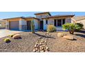 Landscaped front yard with drought-tolerant plants and gravel at 3020 N 165Th Ave, Goodyear, AZ 85395