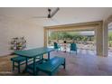 Covered patio with teal furniture and view of backyard at 3020 N 165Th Ave, Goodyear, AZ 85395