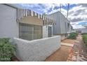 Side view of a condo showing the building's unique architectural style and landscaping at 3416 N 44Th St # 35, Phoenix, AZ 85018