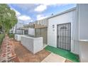 View of condo's entrance with walkway, showing its white stucco exterior and landscaping at 3416 N 44Th St # 35, Phoenix, AZ 85018