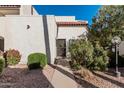 Well-maintained stucco exterior with a walkway and landscaping at 4730 W Northern Ave # 1127, Glendale, AZ 85301