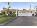 Home with paved driveway, landscaping, and a basketball hoop at 5134 N 33Rd St, Phoenix, AZ 85018