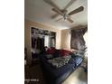 Bedroom with double bed, closet, and ceiling fan at 5616 W Granada Rd, Phoenix, AZ 85035