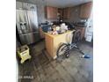 Kitchen area with stainless steel appliances and an island at 5616 W Granada Rd, Phoenix, AZ 85035