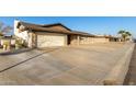 Single-story home with attached garage and driveway at 5732 W Purdue Ave, Glendale, AZ 85302