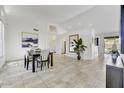 Elegant dining room with dark wood table and large art piece at 6502 E Blanche Dr, Scottsdale, AZ 85254