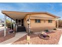 Front view of a manufactured home with covered porch at 6960 W Peoria Ave # 231, Peoria, AZ 85345