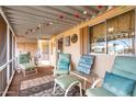 Relaxing screened porch with seating and string lights at 6960 W Peoria Ave # 231, Peoria, AZ 85345