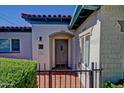 Inviting front door entrance with wrought iron gate and classic, red tile accents at 701 W Cambridge Ave, Phoenix, AZ 85007