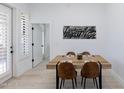 Dining area with wooden table and leather chairs at 7027 N Scottsdale Rd # 225, Paradise Valley, AZ 85253