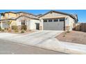 View of house exterior with gray garage door and landscaping at 8513 N 172Nd Ln, Waddell, AZ 85355