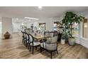 Bright dining room featuring a large wooden table and stylish chairs at 8614 E Appaloosa Trl, Scottsdale, AZ 85258