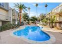 Relaxing kidney-shaped swimming pool in a sunny courtyard setting at 1006 E Osborn Rd # C, Phoenix, AZ 85014