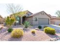 Single-story home with attractive landscaping and a two-car garage at 10359 E Morning Star Dr, Scottsdale, AZ 85255