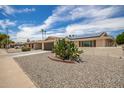 House exterior showcasing street view and solar panels at 10714 W Saratoga Cir, Sun City, AZ 85351