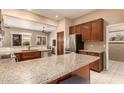 Open kitchen with granite countertops and ample cabinetry at 10949 W Sierra Pinta Dr, Peoria, AZ 85373