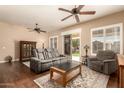 Relaxing living room with hardwood floors and access to the backyard at 10949 W Sierra Pinta Dr, Peoria, AZ 85373