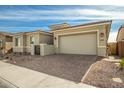 New construction home with a two-car garage and front yard at 11005 E Texas Ave, Mesa, AZ 85212