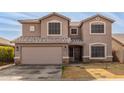 Two-story house with a large garage and landscaped yard at 11163 W Elm Ln, Avondale, AZ 85323