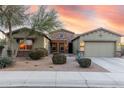 Beautiful two-story home with landscaping and driveway at 18311 W East Wind Ave, Goodyear, AZ 85338