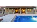 Expansive pool and patio area with outdoor kitchen at 18311 W East Wind Ave, Goodyear, AZ 85338