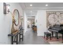 Elegant entryway with a grand piano and stylish console table at 19447 S 209Th Pl, Queen Creek, AZ 85142