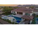 Luxury home with a large pool and expansive backyard at 19780 E Ivy Ln, Queen Creek, AZ 85142