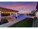 Entertain in style with this expansive pool and covered patio area at 19780 E Ivy Ln, Queen Creek, AZ 85142