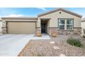 Single-story home with a two-car garage and stone accents at 20017 W Jackson St, Buckeye, AZ 85326