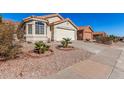 Front view of house with driveway, landscaping, and sidewalk at 2018 E Glenhaven Dr, Phoenix, AZ 85048