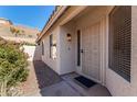 Front entry with security door and well-maintained landscaping at 2018 E Glenhaven Dr, Phoenix, AZ 85048