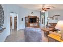 Bright living room with tile floors, comfortable seating, and a large TV at 23699 N Oasis Blvd, Florence, AZ 85132