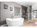 Modern bathroom with soaking tub and walk-in shower at 2626 E Bear Creek Ln, Phoenix, AZ 85024