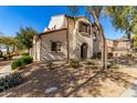 Two-story house with Spanish-style architecture, landscaping, and a walkway at 3703 W Mccauley Ct, Phoenix, AZ 85086