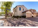 Two-story house with Spanish-style architecture, landscaping, and a driveway at 3703 W Mccauley Ct, Phoenix, AZ 85086