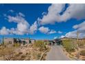 Stunning desert contemporary home with expansive driveway and mountain views at 41104 N 96Th St, Scottsdale, AZ 85262