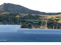 Infinity pool with scenic mountain and golf course views at 41104 N 96Th St, Scottsdale, AZ 85262