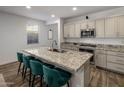 Modern kitchen with granite countertops and stainless steel appliances at 4816 S 117Th Ave, Avondale, AZ 85323